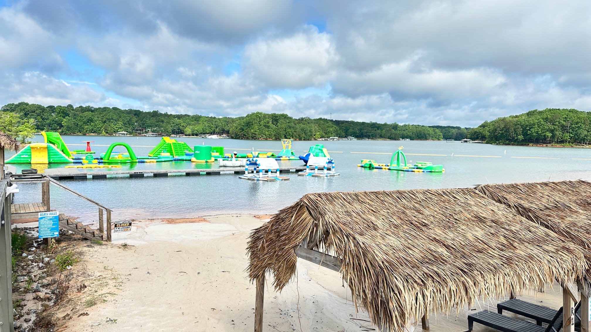 Visitors enjoying the thrilling obstacles at Aqua Zone Floating Waterpark on Lake Hartwell.