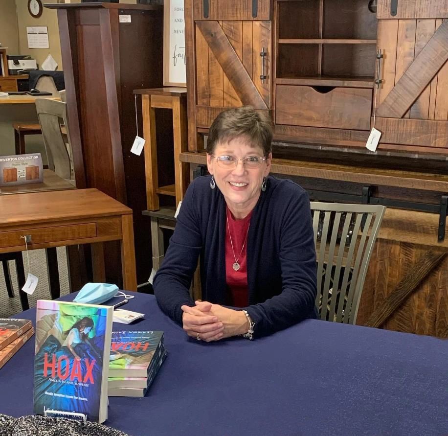 Author and vendor Leanna Sain presenting her Southern Suspense collection at the Holiday Fair.