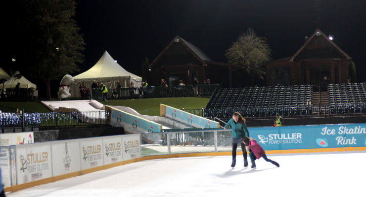 Families enjoying the outdoor ice skating rink at Tryon Winterfest.